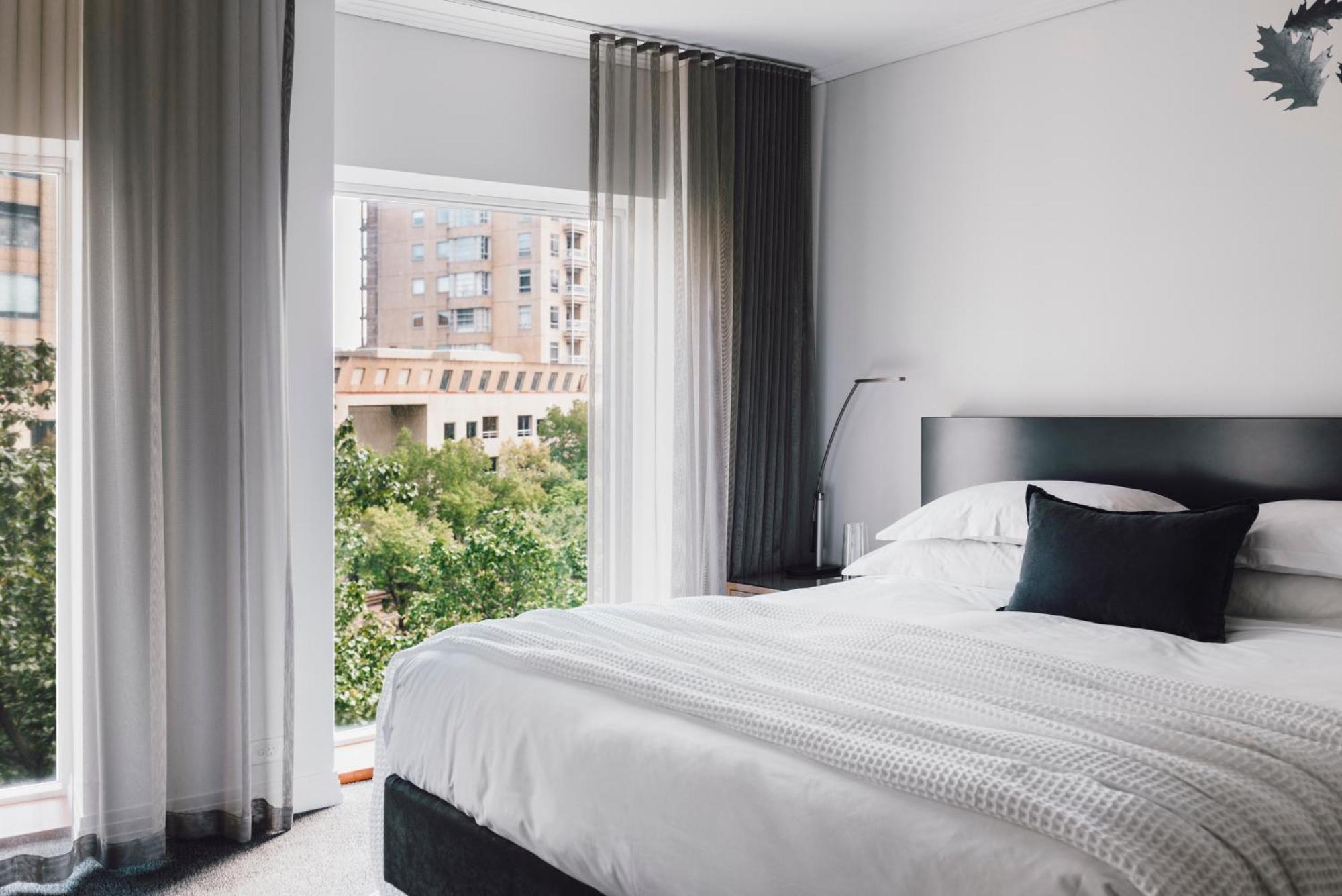 The Como Melbourne Kültér fotó A bedroom